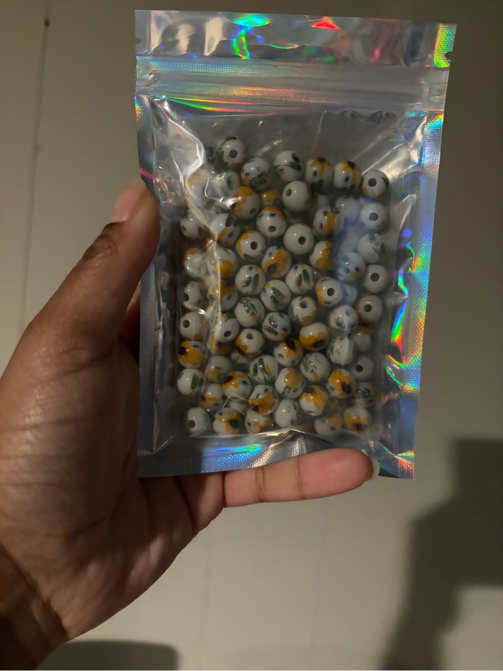 Handmade White Glass Beads with Yellow and Green Floral Accents